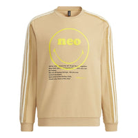 بلوفر رجالي adidas neo x SMILEY Crossover Smly Swt مطبوع عليه وجه مبتسم مخطط رياضي برقبة دائرية لون كاكي H45522