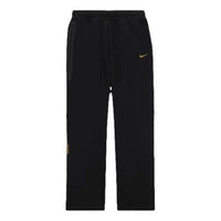 بنطال رياضي Nike x NOCTA Drake Tech Fleece مفتوح الحافة "أسود ذهبي جامعي" FD8460-010