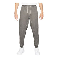 بنطال رياضي رجالي فضفاض كاجوال طويل محبوك مطرز بشعار Nike Sportswear باللون الرمادي DA7163-010