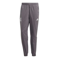بنطلون رياضي طويل للتدريب بقصّة ضيقة من adidas Real Ssp Pnt لنادي ريال مدريد لكرة القدم/كرة القدم باللون الرمادي GI0001